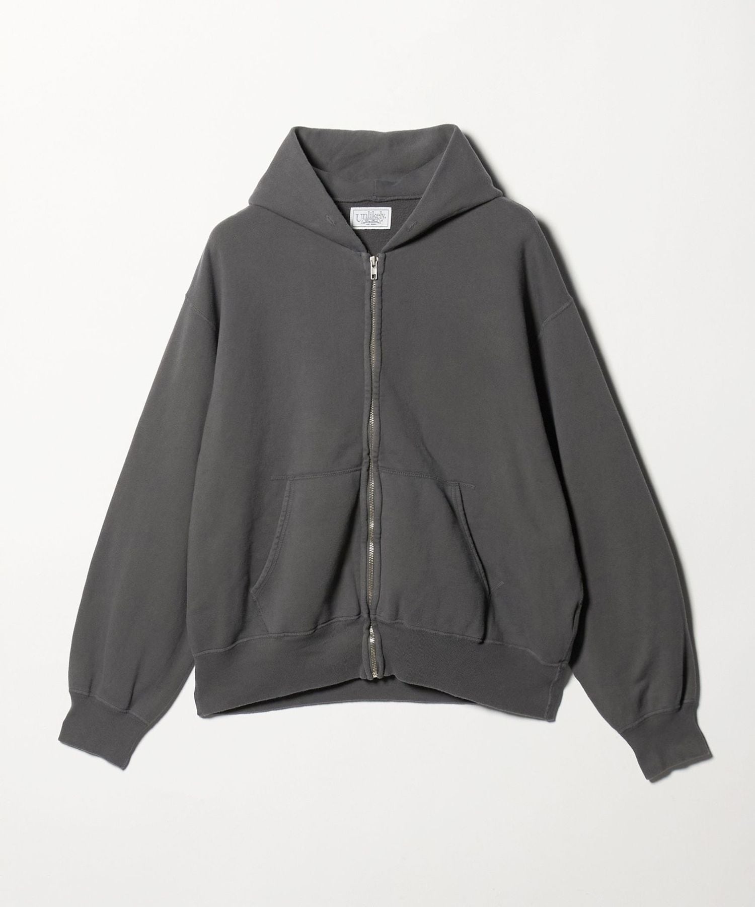 Unlikely＞RAGLAN ZIP HOODIE/フーディ