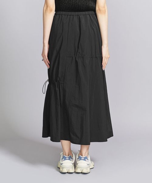 半額以下！新品未使用タグ付き☆ emmi アシンメトリーギャザーナイロンスカート emmi（エミ）の「【emmi atelier】アシンメトリーギャザー